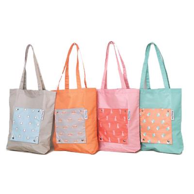 China Folding Waterproof Nylon Shopping Bag Cartoon Printing Folding Handle Storage Tote Bags With Outside Pockets for sale