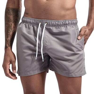 China Anti-Wrinkle Quality Men Fashion Beach Pants 100% Polyester Breathable Solid Color Plus Size Swimming Fitness Shorts Quick-drying For Men for sale