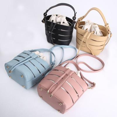 China 100% PU Leather Cross New Eco-friendly Hollow Portable Bucket Bag - Body Bag For Grill for sale