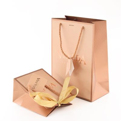 China Recycled Brown Paper Cardboard Materials Boutique Transparent Luxury Gold Christmas Elegant for sale