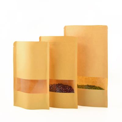 China Recycled Materials Stand Up Ziplock Bag With Clear Window High Quality Kraft Paper Food Bag With Logo for sale