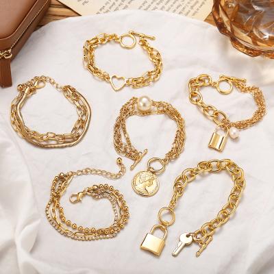 China Hiphop 2021 Luxury Punk Gold Cuban Link Chain Bracelet Style Pearl Metal Portrait Coin Heart Pendant Bracelets For Women for sale