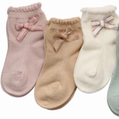 China Autumn Baby Socks Breathable Cotton Solid Color Non-slip Baby Socks Cute Socks With Bow for sale