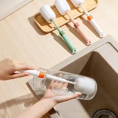 China Viable Customize Soft Sponge Cleaning Bottle Long Handle Retractable Baby Feeding Water Cup Soft Bottle Brush for sale