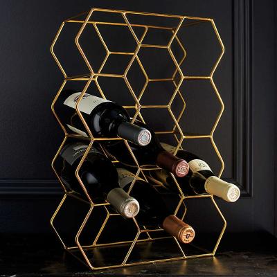 China OEM Creative Household Honeycomb Shape Gold Metal Wine Rack Tp-171 for sale