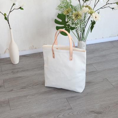 China Sturdy and durable handled canvas shopping bags can be customized with printing patterns for sale