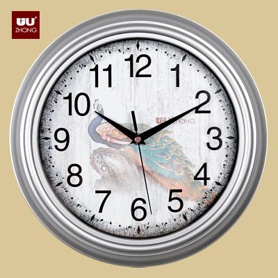 China Wholesale Cheap Wholesale Diamond Brown White Peacock LUMINOVA Hotel Home Restaurant Black Frame Plastic Decorative Wall Clock for sale