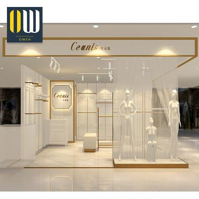 China Retail Store Fixture Clothing Store Design Metal Gold Display Rack Commercial Deploying Hanging Clothes for sale