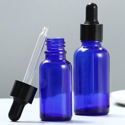 China 15ml 20ml 30ml Pharmaceutical Coalt Essential Oil Blue Glass Bottle With Clear Dropper Tamper CCT Cap for sale