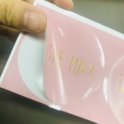 China Logo Printing Roll Transparent Waterproof Custom Sticker Brand Clear Gold Foil Self Adhesive Private Sticker for sale