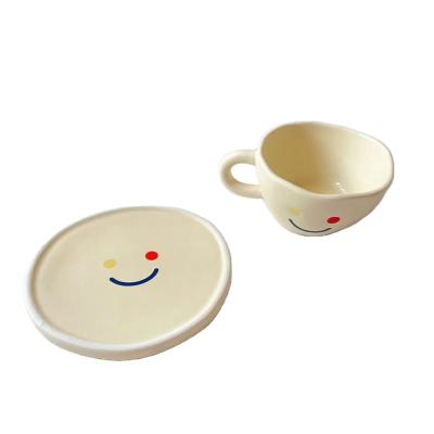 China Sustainable Household Ceramic Coffee Mug With Smiling Face Pattern Cup And Saucer Milk Cup Coffee Mug for sale