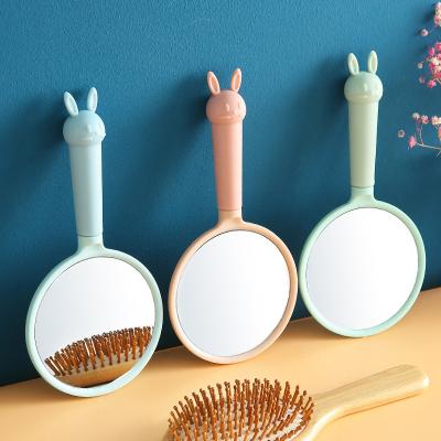 China Wholesale Cute Rabbit Hand Shape Pocket Mirror Lighted Handheld Vanity Mirror Cute Rubber Compact Makeup Mirror For Gift for sale