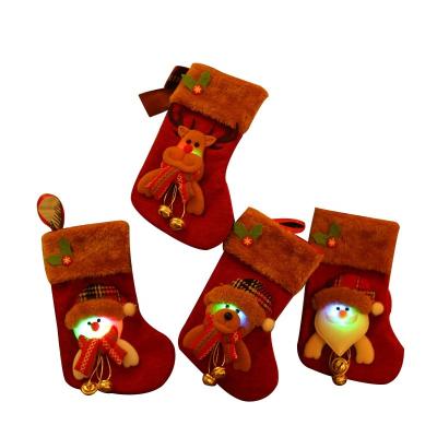 China Cloth 2022 LED light Small Candy Gift Socks Red Mini Wholesale Christmas Tree Indoor Ornament Christmas Stocking for sale