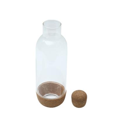 China Factory wholesale minimalist creative portable glass small transparent round sealed glass bottle with lid for sale