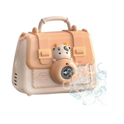 China Kids Camera Toy Cute Cow Handbag Electric Bubble Machine Cartoon Multi Hole Bubble Blowing Toy Camera Rocket Electric Bubble Gun for sale