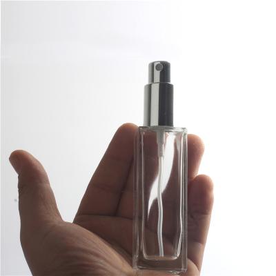 China Chemical Silver Clear Toner Spray Bottle Square Metal Cover Glass Perfume Bottle 30ml for sale