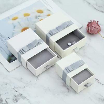 China Sweet and High Quality Custom Jewelry Packaging Boxes Logo Gift Earring Necklace Ring Jewelry Box for sale