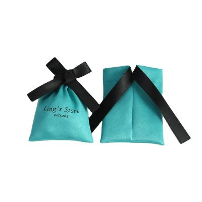 China 9x12cm newest soft and high quality luxury custom made earrings suede jewelry pouches with bow-knot for sale