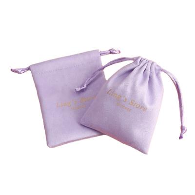 China 5x7cm Flannel Velvet Cord Soft and High Quality Jewelry Pouch Purple Packaging Ring Earrings Gift Bags With Logo for sale