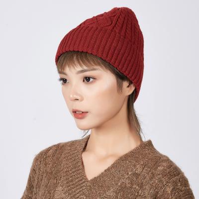 China 2021 COMMON Korean Twist Hat Winter Brimming Knitted Warm Hats For Women Custom LOGO for sale