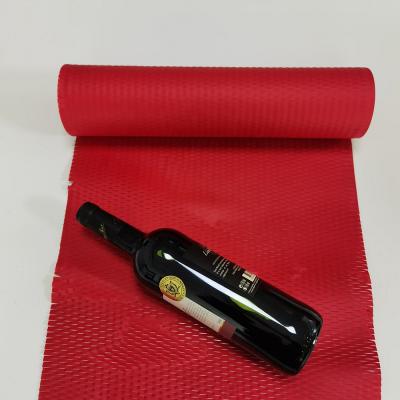 China Hysen Disposable Boutique Red Color 50cm*3m Degradable Composted Gift Paper Roll For Wine Wrap Honeycomb Kraft Paper Cushion Wrapping for sale