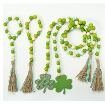 China String Tassel Garland Festival Home Wall Door Decoration Bead Wood Napkin Ring St. Patrick's Day Wooden Shamrock Pearl String Tassel Garland for sale