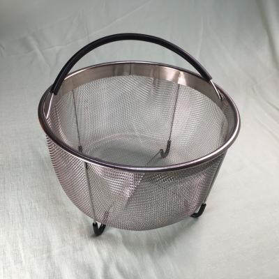 China Sustainable stainless steel steamer basket for pressure cookers with silicone handle and non-slip legs for sale