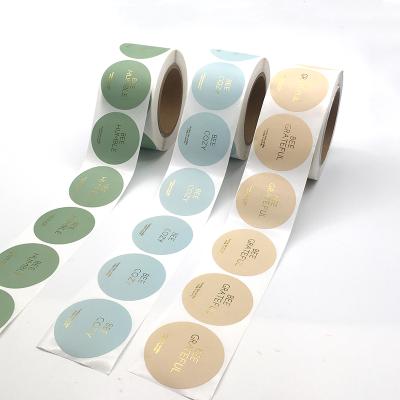 China Logo Printing Roll Labels Gold Custom Heat Sensitive Foil Self Adhesive Private Sticker Waterproof Label for sale