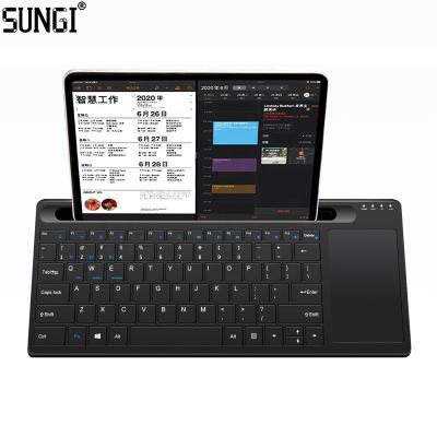 China Portable 2.4G Wireless WiFi and BT Keyboard Touchpad Dual Mode Wireless Rechargeable Keyboards with Stand for iPad Tablet for sale