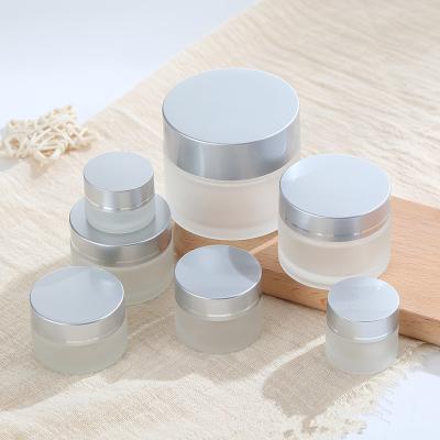 China 50ml 50G Matte Frost Cream Glass Cosmetic Jar with Aluminum Lid for sale