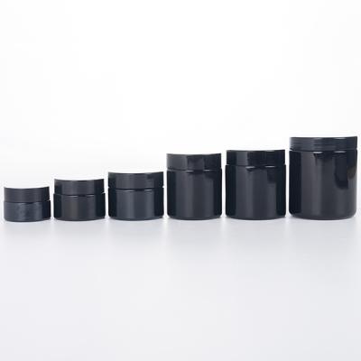 China Straight Sided Black Cosmetic Deep Process Glass Jar Food Storage Jar With Lids for sale