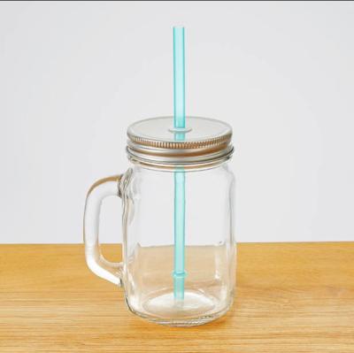 China Viable Clear Glass Mason Jar With Handle 16oz Mason Jar With Silver Lid And Plastic Straw for sale