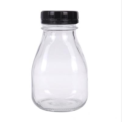 China Recyclable Glass Bottle 300ml Squat Milk Juice Beverage Mill-Shake Food Grade Glass Bottle for sale