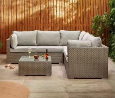 China Sofá de ratan de vidrio para exteriores Conjunto de silla de ratan con cojín seccional Muebles de jardín de césped en venta