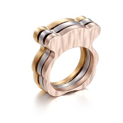 China Women's Stainless Steel Band Rings Hot Designs Personalized Stainless Steel Bear Shaped Simple Band Tri Color Ladies Ring for sale