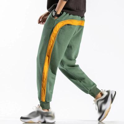 China New Anti-Wrinkle Sweatpants Men Side Striped Trouser Pants Hip Hop Pants Men Loose Fit Harem Pants for sale