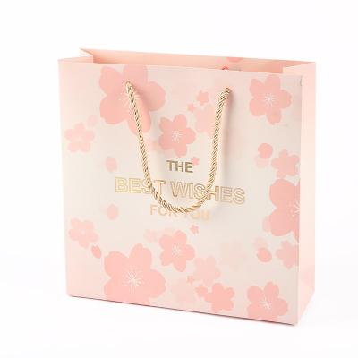 China Recycled Materials Customized Logo Kraft Paper Flower Garment High End Retail Paper Bag for sale