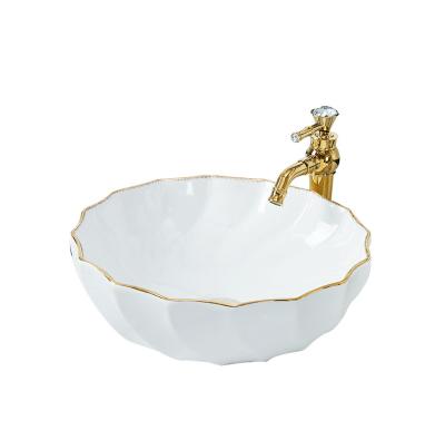 China Modern Design Modern Wholesale Nordic Countertop Ceramic Basin Sink With Gold Trim for sale