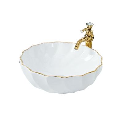 China Modern Nordic Fancy Hand Ceramic Sink Above Countertop Wash Basin for sale