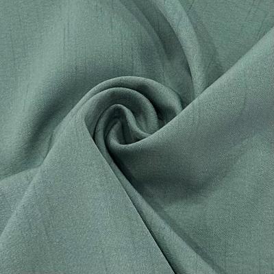 China 98% Polyester 2% Spandex Cationic Polyester Fabric 137GSM Dyed Bamboo Slub Weft Elastic Twill for sale