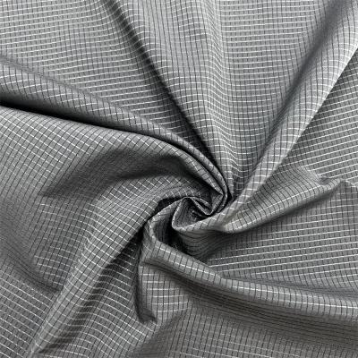 China 75D Low Elasticity T400 Hollow Grid Fabric 100% Recycled Polyester Perforated Grid Pattern en venta