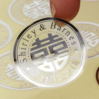 China Waterproof Professional Custom Silver Foil Stamping Embossed Printed Round Logo Sticker Manufacturer for sale