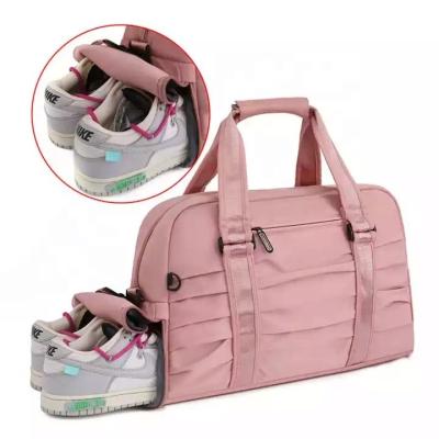 China Waterproof Wholesale Fashion Pink Duffle Bag Trending Designer Waterproof Portable Polyester Luggage Gym Sport Travel  fitness yoga Bag for sale