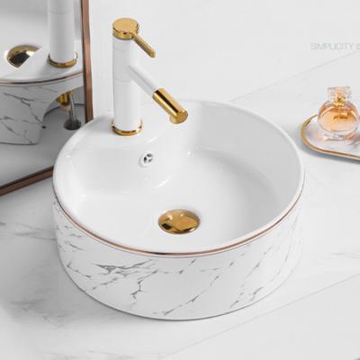 China 2022 Luxury Simple Indoor Single On Counter Basin Rectangular Ceramic Art Wash Basin White Gold Edge With Faucet Hole for sale