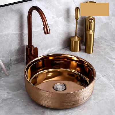 China European style luxury new color luxury countertop brushed small round rose gold bathroom sinks bibcock rose gold hand basins for sale