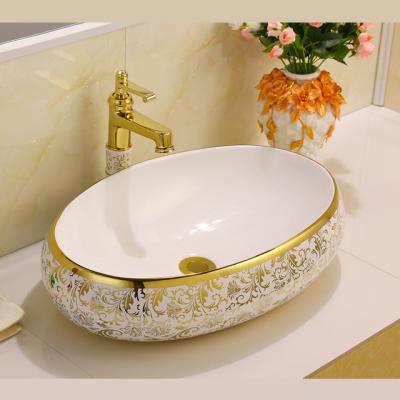 China ODM/OEM Luxury Ceramic Hair Wash Sink Art Oval Countertop Basin Set Faucet Rose Gold Wash Basin Royal Sinks for sale