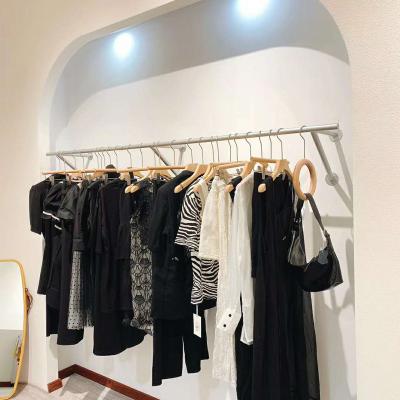 China Clothes Shop Silver Smooth Scratch Resistant Clothes Display Racks Stainless Steel High Quality Thick Boutique Clothing Racks On The Wall for sale