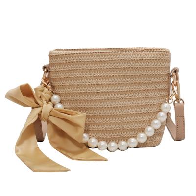 China 2021 New Vintage Design Beach Straw Bag Fashion Pearl Handle Straw Crossbody Bag For Women for sale