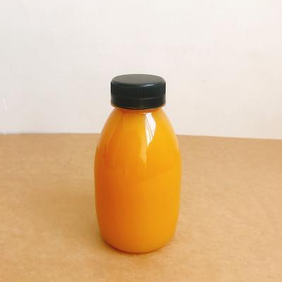 China Hot Filled Milk Juice Pet Bottles Round Bottle Food Grade Plastic Pet Juice Bottle With Cap for sale