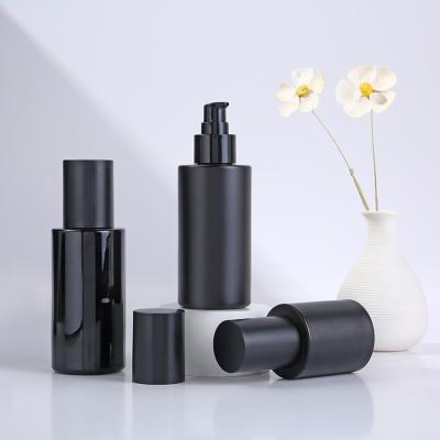 China Facial Cleanser Glass Collar Material 30ml 50ml 100ml Perfume Bottle Black Frosted Cosmetic Makeup Packaging Vendors for sale